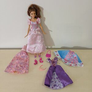 Brunette Barbie with princess dresses and accessories